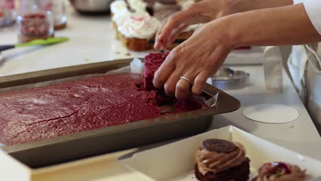 Crop-cook-preparing-sponge-cakes-in-kitchen