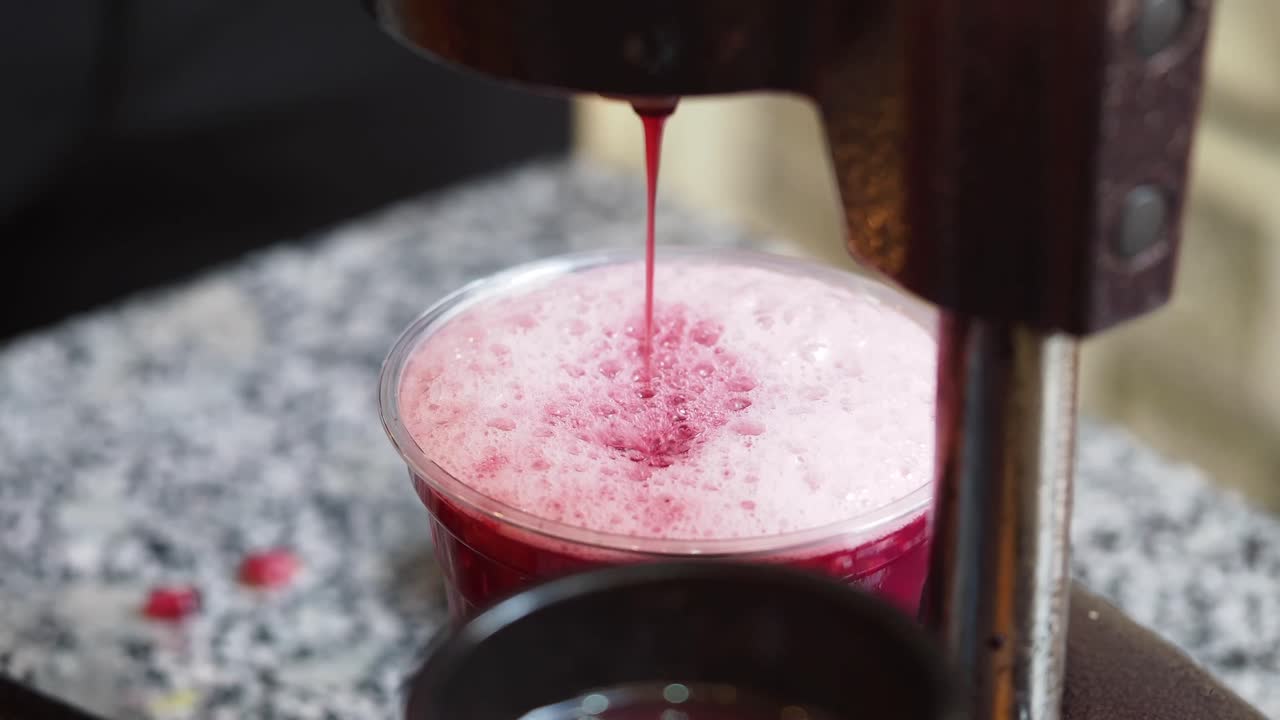 Pomegranate Juice Being Made