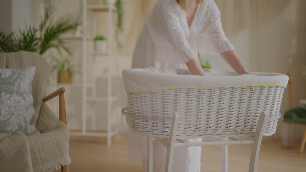 Pregnant Woman Prepares Nursery for Baby