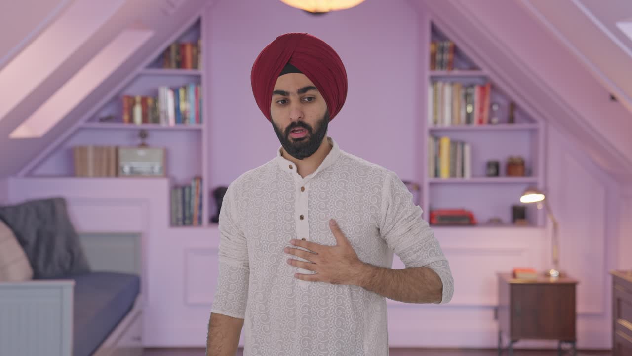 Uomo indiano Sikh malato con un attacco d'asma