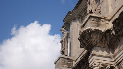 ancient roman arch with statues