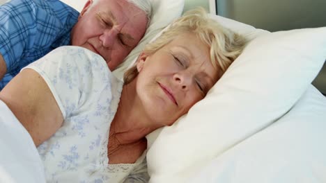 Senior-couple-sleeping-in-bed