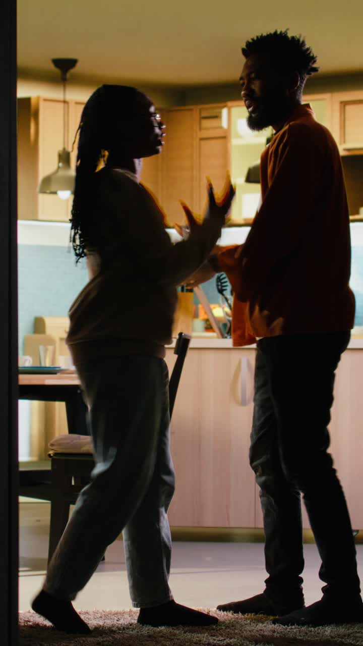 Vertical Video Young black people fighting in dark hallway looking angry and enraged
