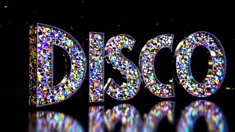 colorful, shimmering disco letters sparkling against a black background, radiating a vibrant and festive atmosphere perfect for celebrations, parties, and nightlife excitement