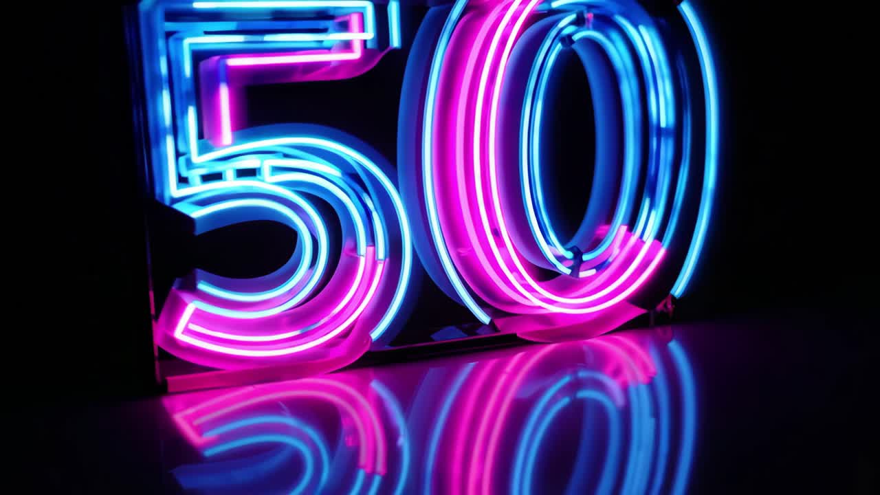 Glowing neon number fifty illuminating dark surface with vibrant pink and blue luminescence, signaling significant achievement or commemorative moment