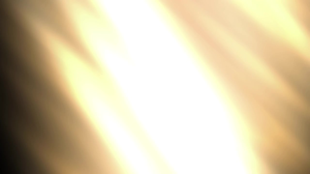 Warm Golden Light Rays Passing Across a Dark Background