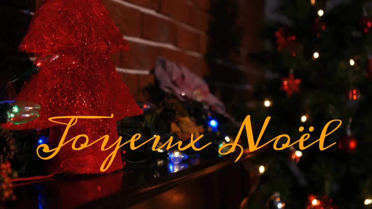 크리스마스 장식 위에 joyeux noel 텍스트의 애니메이션
