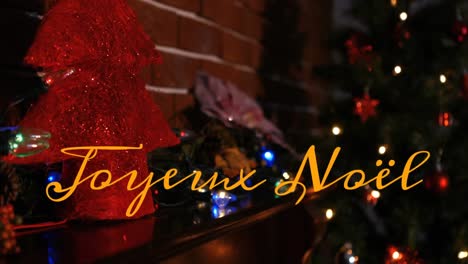 animation of joyeux noel text over christmas decorations