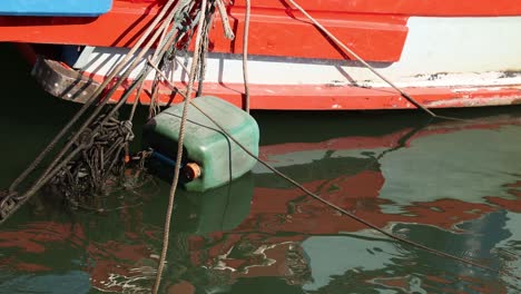 a stationary boat tied to a dock over time