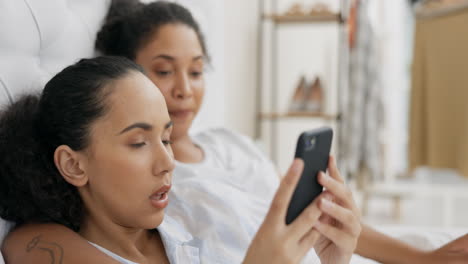 Phone,-bed-and-couple-of-friends-relax-with-social