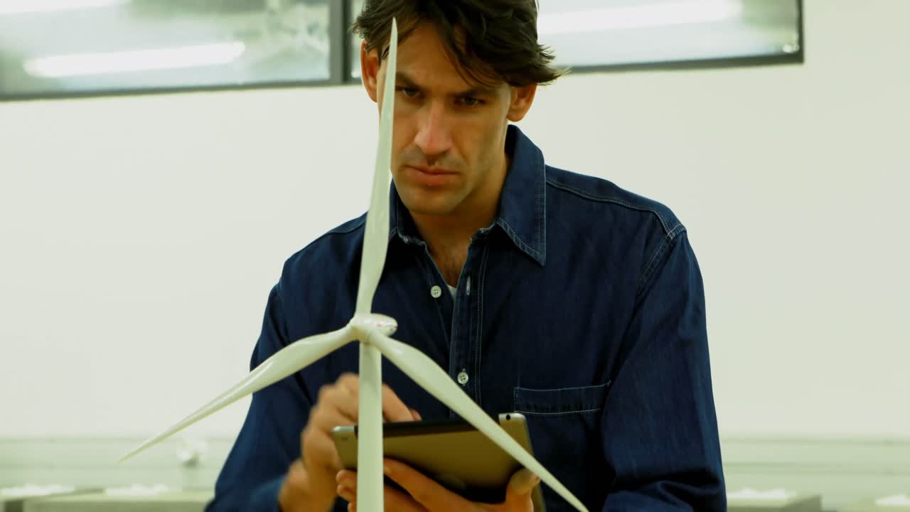 Male worker using digital tablet in office 4k