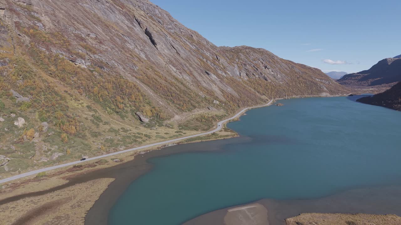 Panoramic view of scenic route and glacier lake from Jotunheimen National Park