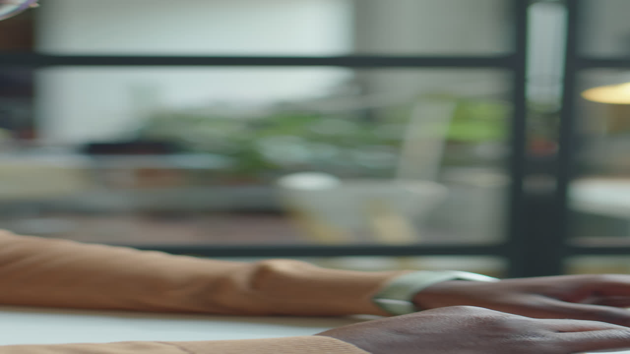 Black Office Worker Typing on Laptop