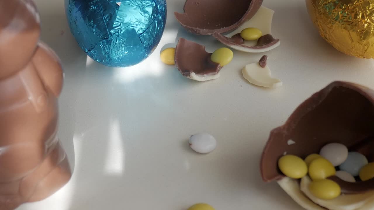 Chocolate bunny and eggs with candy evoke Easter joy