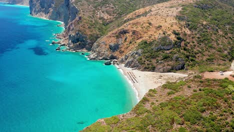 Air-view-of-kaladi-beach-between-two-hills-in-Kythira,-Greece