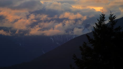 mountain clouds during sunset - time lapse