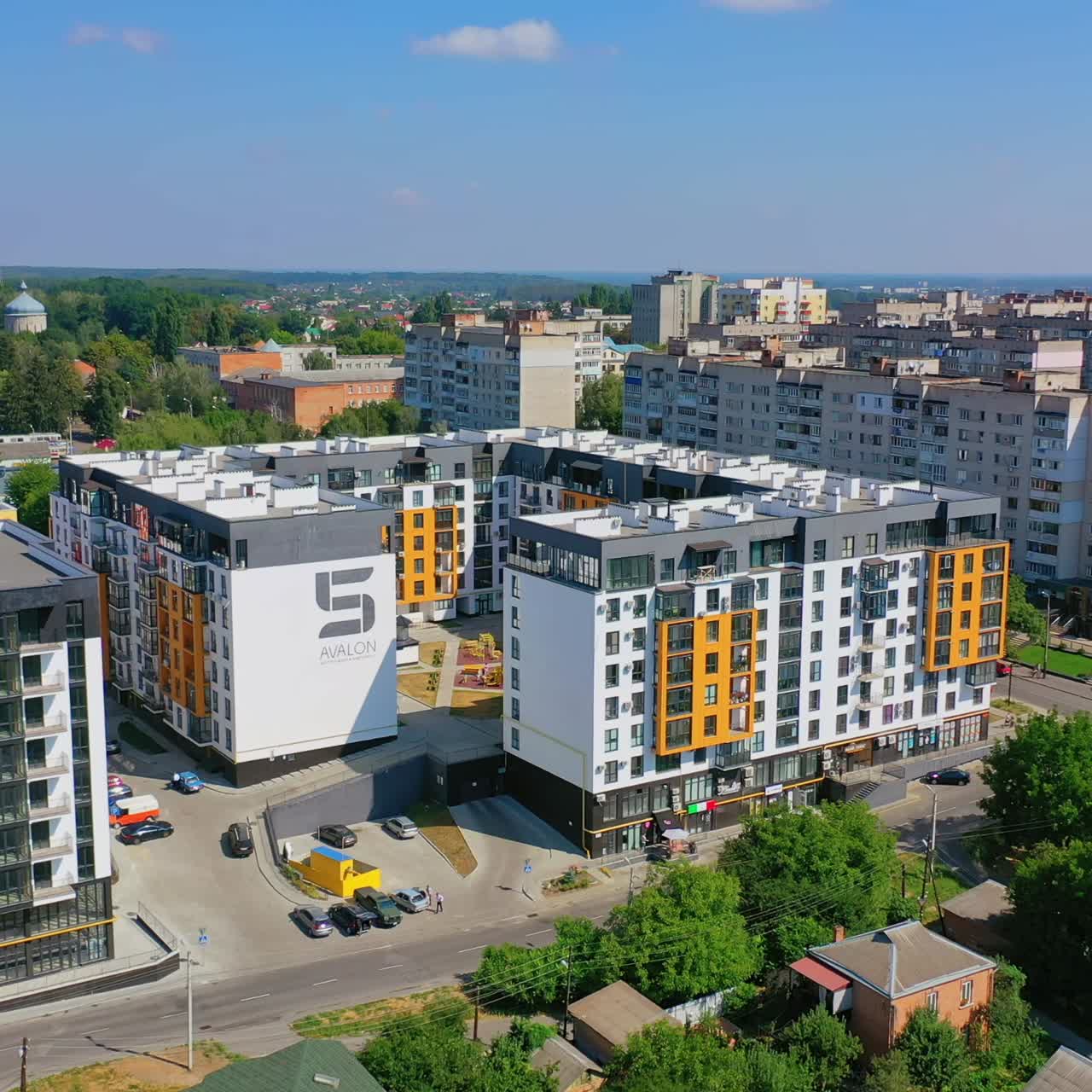 New apartment houses. Modern district in big town. Aerial panoramic video. Colorful bright high-rise buildings.
