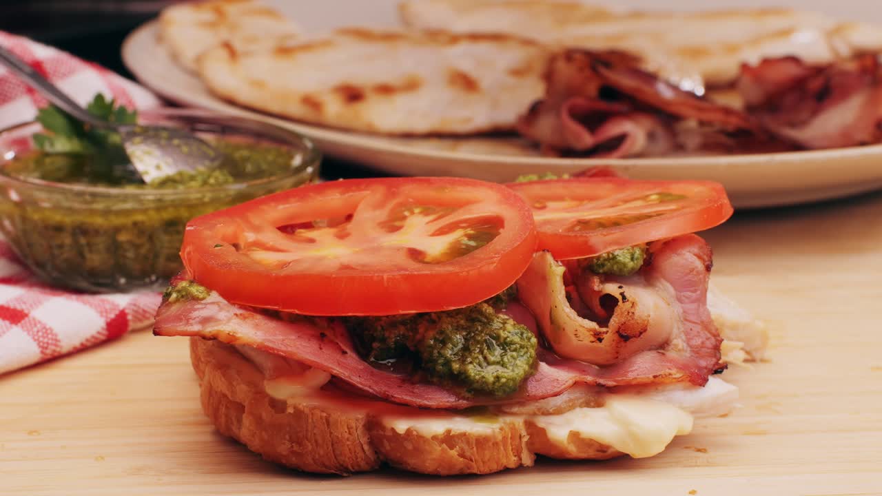 Croissant with jamon ham, Salmon, in Modern Cafe, Top View of Healthy Breakfast in Cafe. English breakfast: fried egg, bacon toast on sandwich.