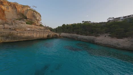 Dramatic-FPV-aerial-flies-over-clear-sea-water