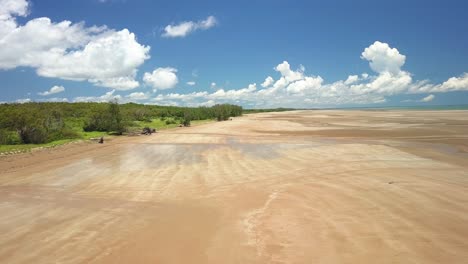 aerial low shot of the big unspoiled lee point beach in darwin, northern territory, australia