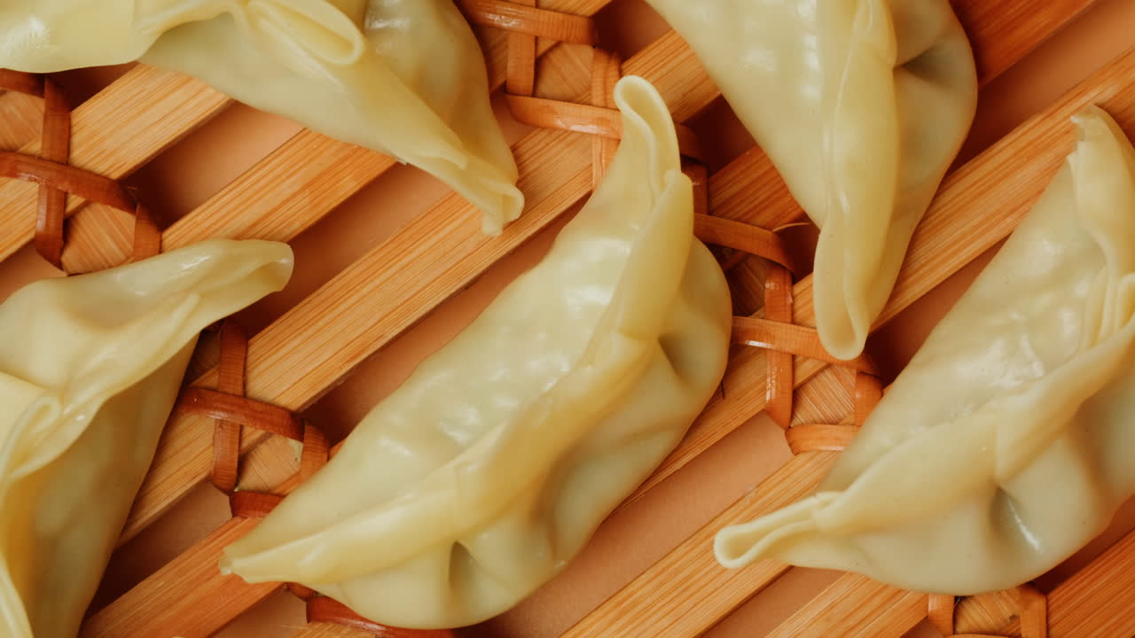 Close-up of Freshly Steamed Gyoza Dumplings in a Bamboo Basket