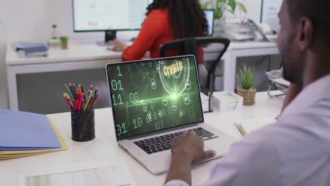 Video-of-african-american-man-working-on-laptop-with-crypto-currency-on-screen