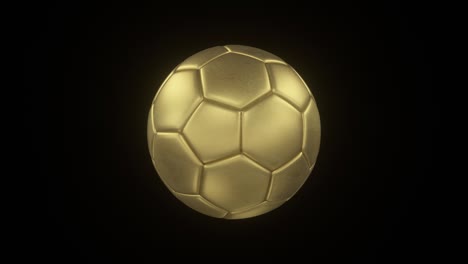 rotating bronze soccer ball on black isolated background