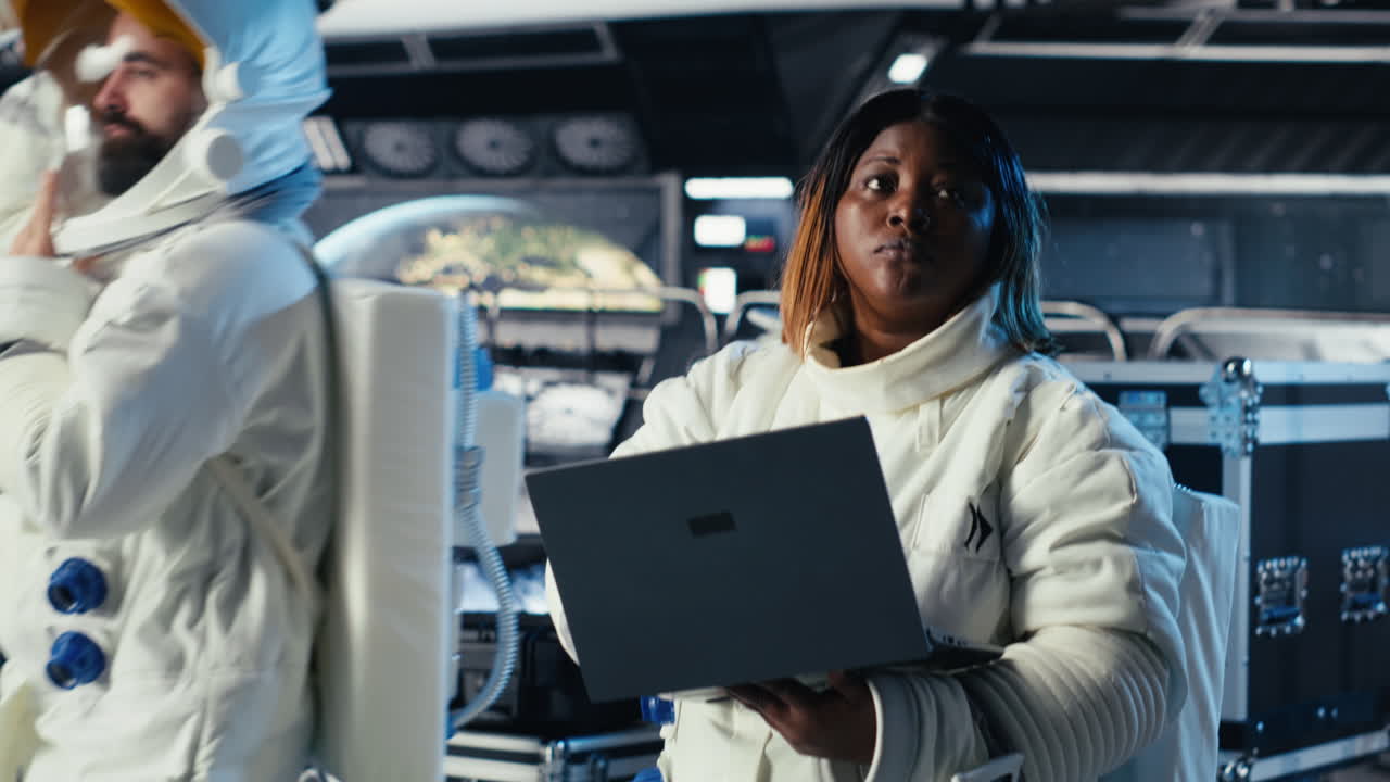 Astronaut checks orbital navigation data in cockpit after completing expedition