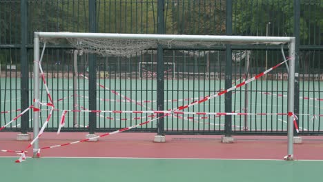 a taped goal is seen at a closed football court playground in hong kong