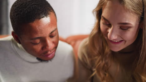 pretty woman talks to nodding african-american groupmate