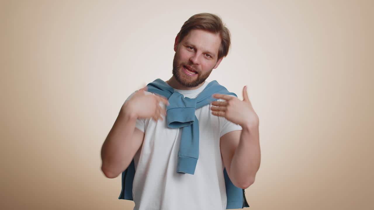 Man showing inviting gesture with hands ask to join beckoning to coming gesturing hello goodbye