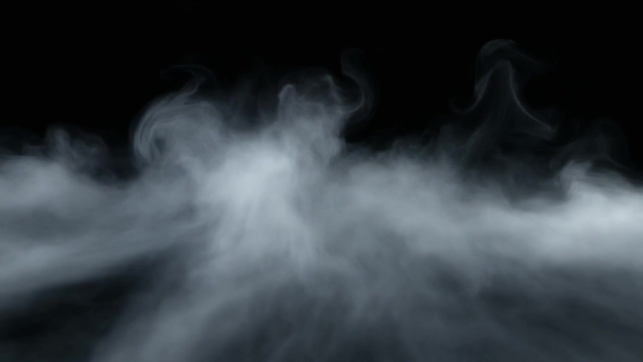 Fumo bianco denso o nebbia che si propaga su sfondo nero