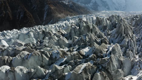 Rocky-Surface-Covered-With-Snow-At-Raikot-Glacier-In-Nanga-Parbat's-North-Flank,-Northern-Pakistan