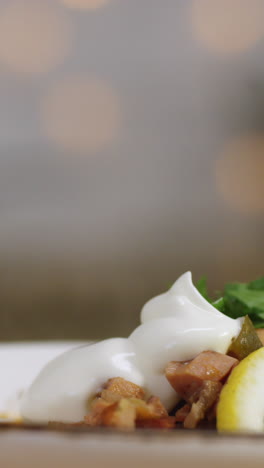 chef preparing a creamy dish with mayonnaise topping