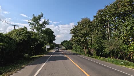 progression of a vehicle driving down a rural road