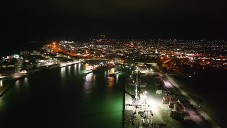 aerial night illuminated cityscape of timaru town over harbour, south island, new zealand