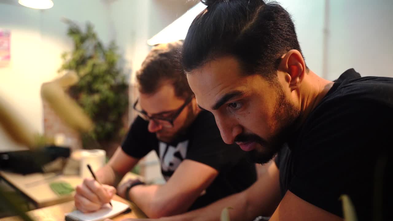 Baristas discussing work issues in cafe