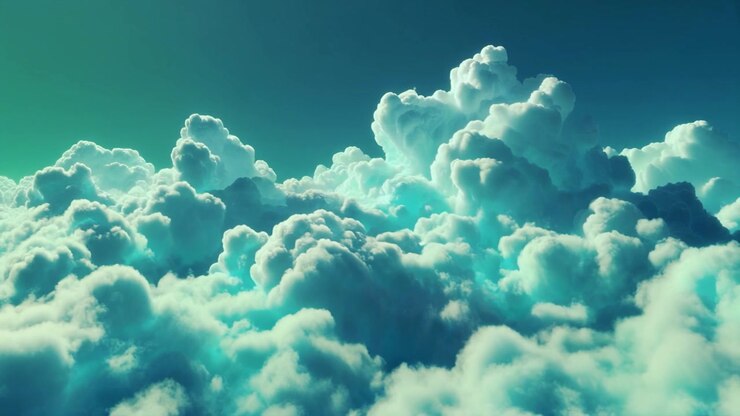 Aerial View of Dense White Clouds in Teal Sky