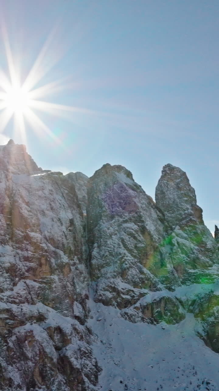 Aerial drone view of the Gardena Pass high mountain pass in the Dolomites, Italy. Vertical