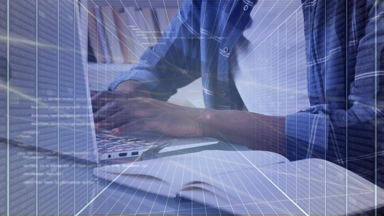 Man coding on laptop while checking notes, pausing and gesturing with grid overlay showing data