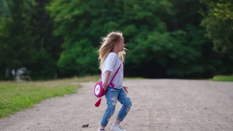 girl having fun outdoors. rear view of small girl running away in park