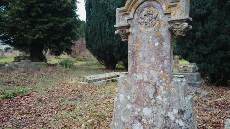 old weathered grave headstone in a church yard