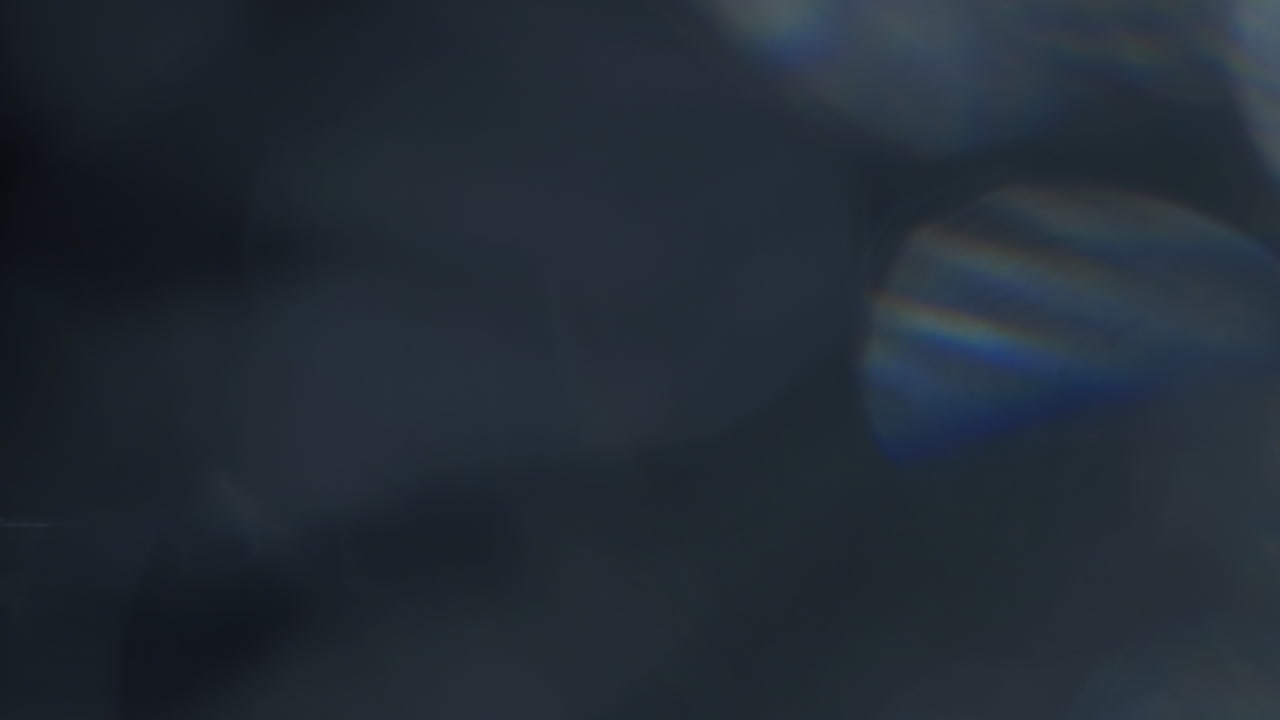 Abstract Light Leaks and Bokeh Overlay on Dark Background