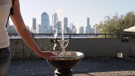 drinking fountain with brisbane cbd in background, australia