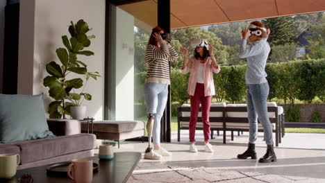using vr headsets, diverse female friends enjoying virtual reality in living room