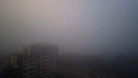 a thick layer of stormy fog blankets over parts of sydney, time lapse of sydney covered by thick and heavy fog at princess highway from the balcony