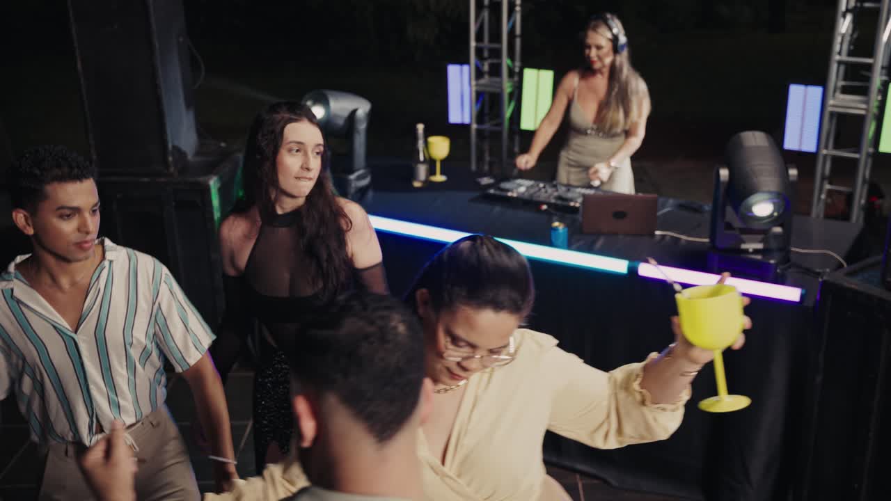 Friends Dancing and Enjoying a Lively Night Party