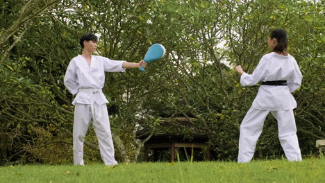 young girl practising kicks