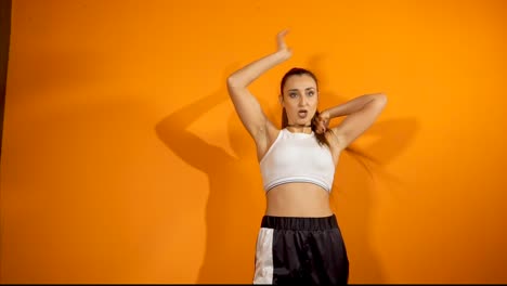 young woman performing hip-hop dance