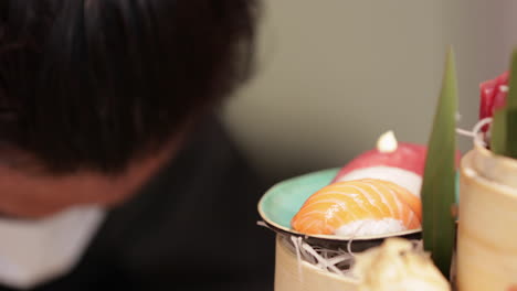 platter of sushi - a traditional japanese dish of prepared vinegared rice